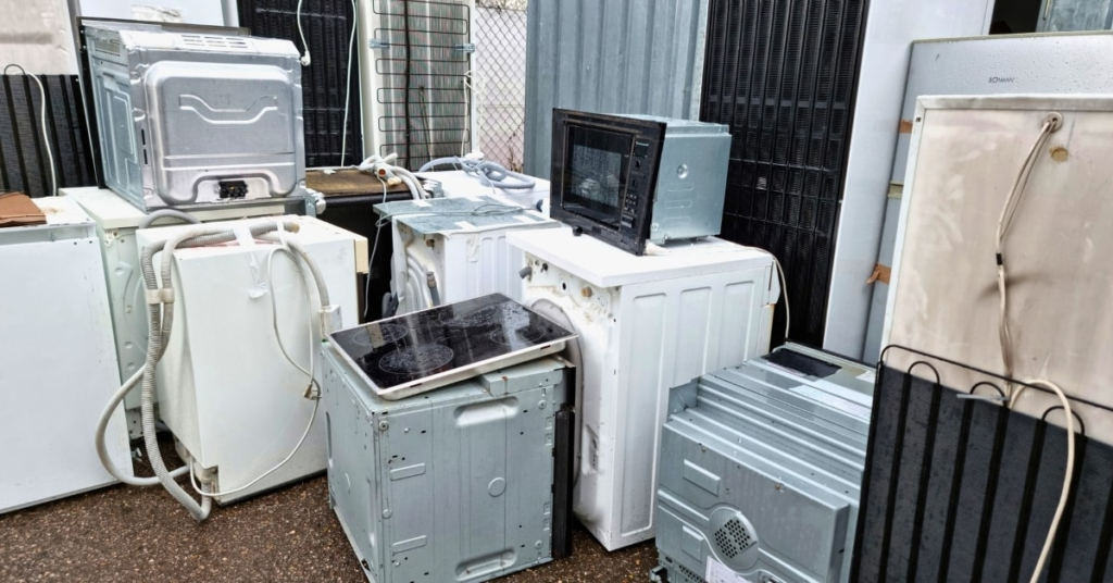 Old appliances ready for pickup and recycling during a Junk Boss appliance removal job in Oklahoma City.